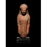 A Greek Terracotta Kore Height 5 7/8 inches.