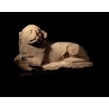 An Egyptian Limestone Recumbent Lion Height 10 3/4 x