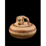 A Mycenaean Pottery Stirrup Jar Height 4 1/2 inches.