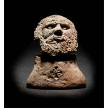 A Romano-Egyptian Terracotta Male Head Height 2 inches.