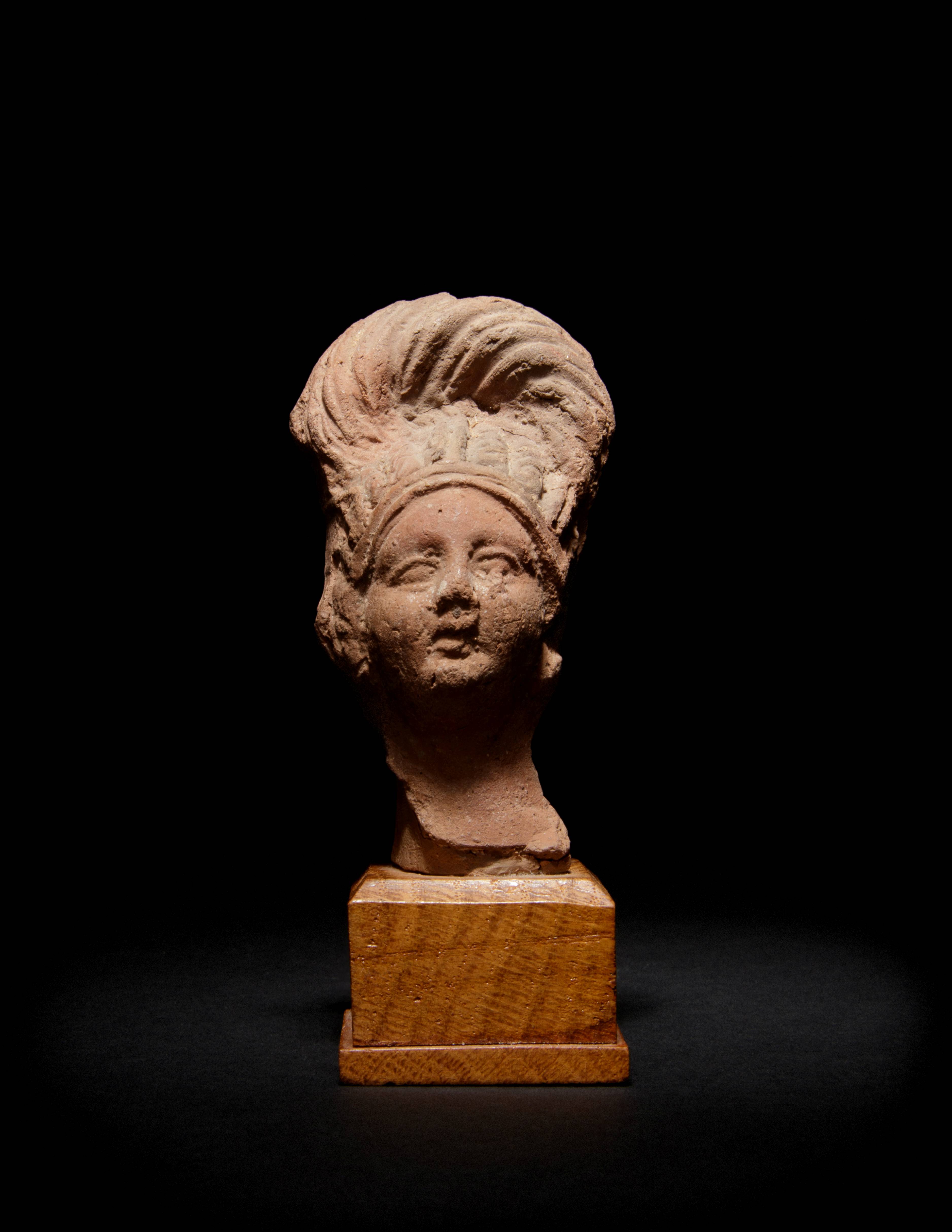 A Romano-Egyptian Terra Cotta Bust Height 3 1/2 inches.