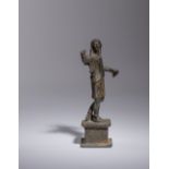 A Roman Bronze Figure of a Man Height 5 5/8 inches.