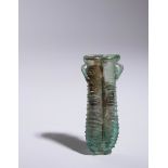 A Roman Glass Double Unguentarium Height 3 7/8 inches.