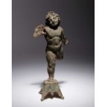A Roman Bronze Figure of Eros Height 6 1/2 inches.