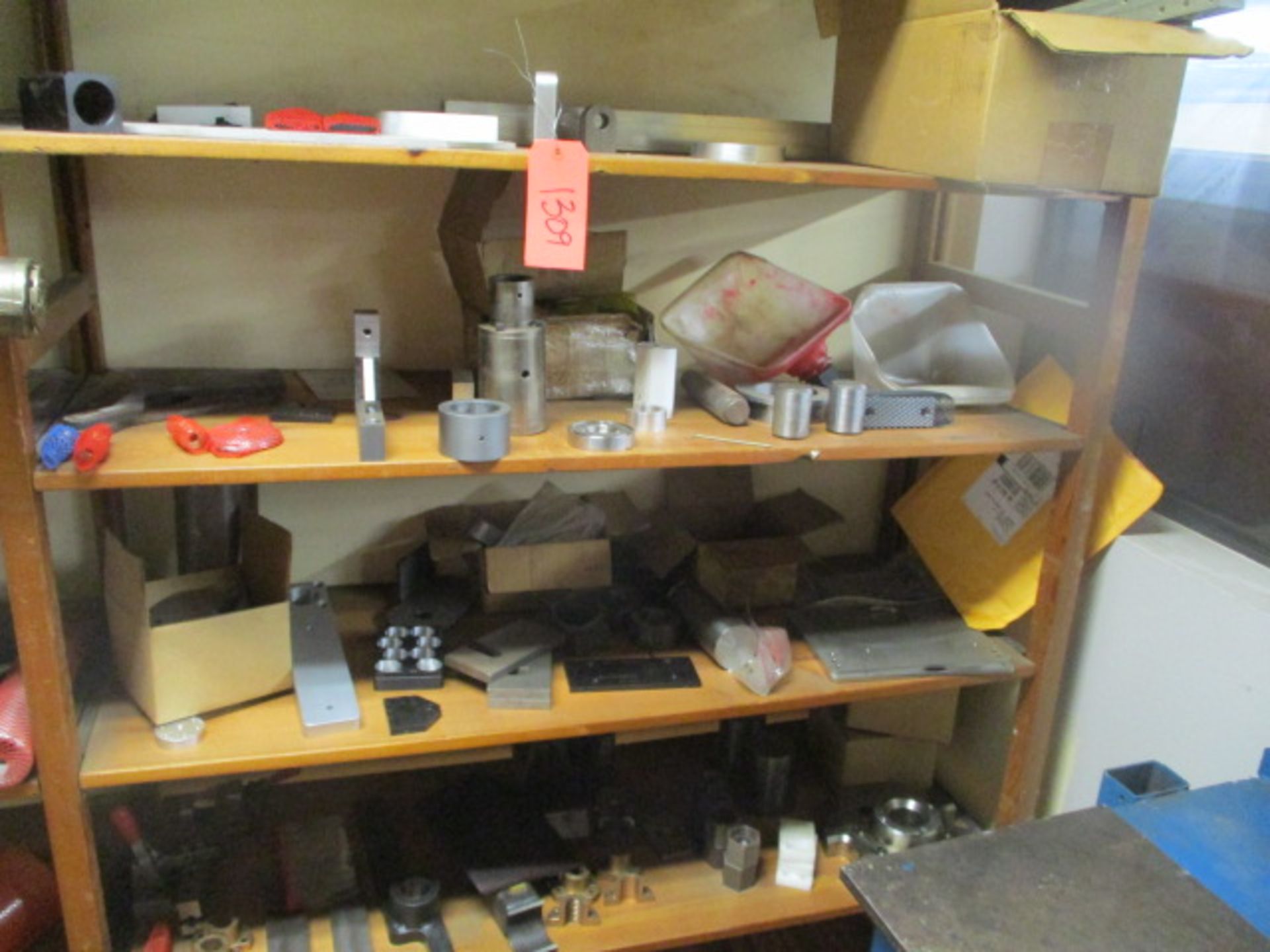 4 shelves of metal items and parts
