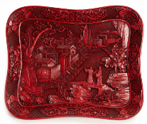 A RED LACQUERED DECORATIVE TRAY