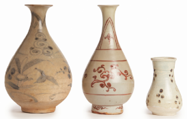 A GROUP OF THREE EARLY PEAR-SHAPED VASES