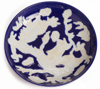 A REVERSE-DECORATED BLUE AND WHITE 'DRAGON' DISH