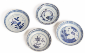 FOUR BLUE AND WHITE PORCELAIN SAUCERS