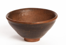 A BROWN-GLAZED POTTERY BOWL