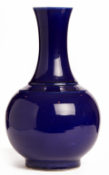 A BLUE MONOCHROME PORCELAIN BOTTLE VASE