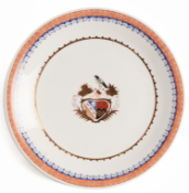 A CHINESE EXPORT ARMORIAL STYLE PORCELAIN DISH