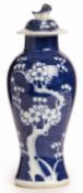 A SMALL BLUE AND WHITE BALUSTER PRUNUS VASE AND COVER