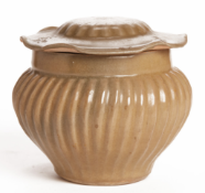 AN OLIVE-GLAZED FLUTED JAR AND COVER