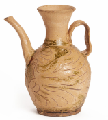 AN INCISED POTTERY EWER