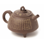 AN INSCRIBED YIXING POTTERY TEAPOT