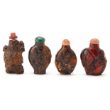 A SET OF FOUR AMBER-TYPE RESIN SNUFF BOTTLES