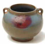 A JUN GLAZED TWIN HANDLED POTTERY JAR