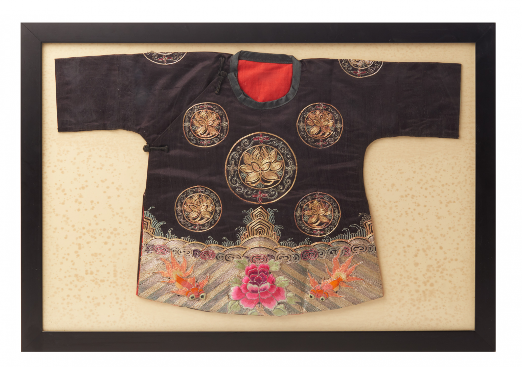 AN ANTIQUE CHINESE EMBROIDERED CHILD'S GOWN