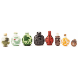 A SET OF EIGHT SNUFF BOTTLES IN VARIOUS MATERIALS