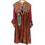A MUTLI-COLOURED AND BEADED ETHNIC ROBE