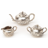 A CHINESE EXPORT SILVER THREE PIECE TEA SERVICE