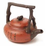 AN INSCRIBED YIXING POTTERY TEAPOT