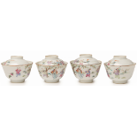 A SET OF FOUR CHINESE FAMILLE ROSE TEA BOWLS AND COVERS