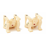TWO IVORY FIGURINES IN THE FORM OF EROTICALLY THEMED DICE