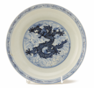 A BLUE AND WHITE DRAGON DISH