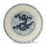 A BLUE AND WHITE DRAGON DISH