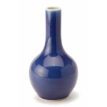 A BLUE MONOCHROME BOTTLE VASE