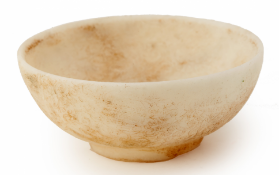 A SMALL INCISED WHITE STONE BOWL