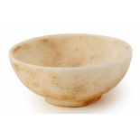 A SMALL INCISED WHITE STONE BOWL