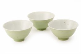 THREE GREEN GLAZED PORCELAIN BOWLS