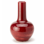 A LARGE RED GLAZED BOTTLE VASE