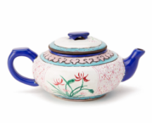 AN ENAMELLED YIXING POTTERY TEAPOT