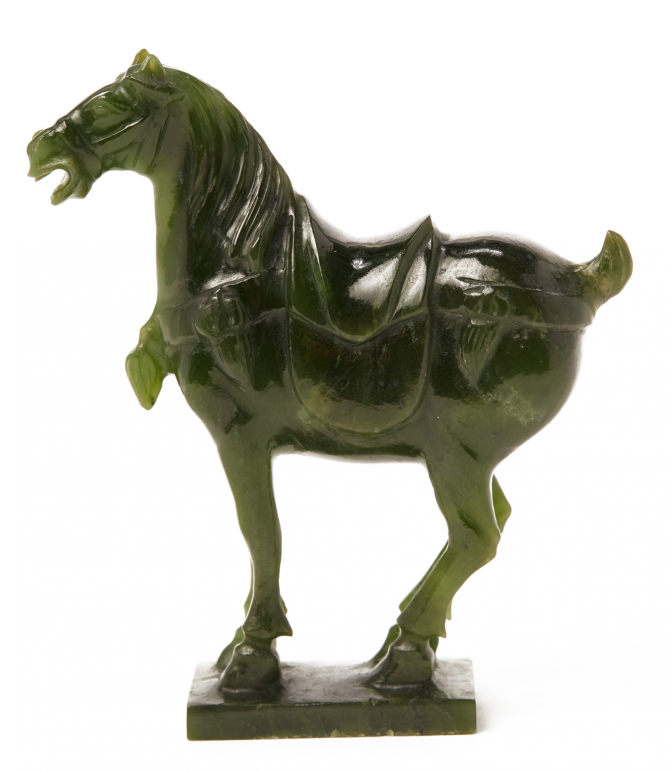 A CARVED JADE HORSE