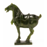 A CARVED JADE HORSE