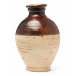 A BROWN HALF-GLAZED OVOID JAR