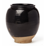 A BLACK-GLAZED POTTERY VASE