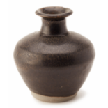 A BLACK-GLAZED POTTERY JAR