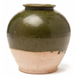 A SMALL DARK GREEN-GLAZED POTTERY JAR