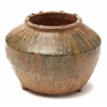 A GREEN-GLAZED POTTERY JAR