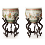 A PAIR OF LARGE FAMILLE VERTE PORCELAIN JARDINIERES, ON STANDS