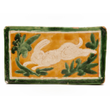 A CIZHOU SANCAI-GLAZED PILLOW WITH RUNNING HARE