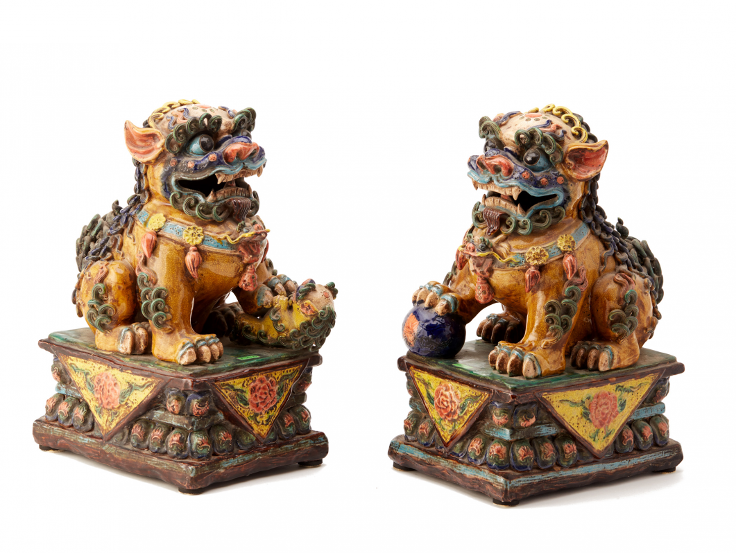 A PAIR OF VIVIDLY GLAZED POTTERY FOO DOGS (2)