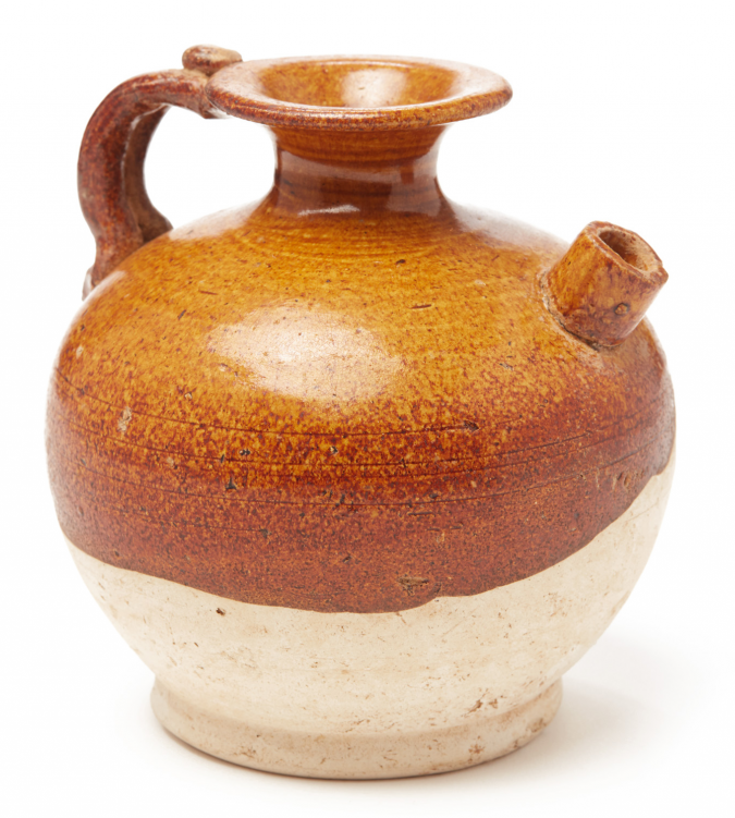 A SMALL BROWN-GLAZED GLOBULAR POTTERY EWER