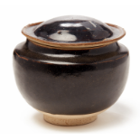 A BLACK-GLAZED JAR AND A COVER