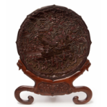 A CARVED CINNABAR LACQUER CHARGER